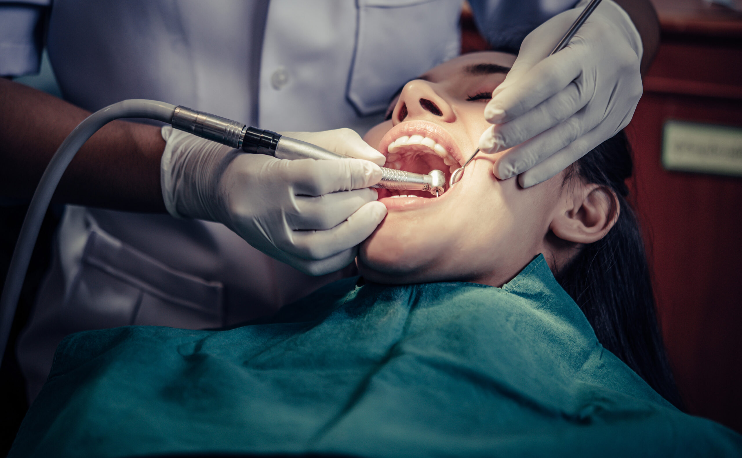 dentists treat patients teeth